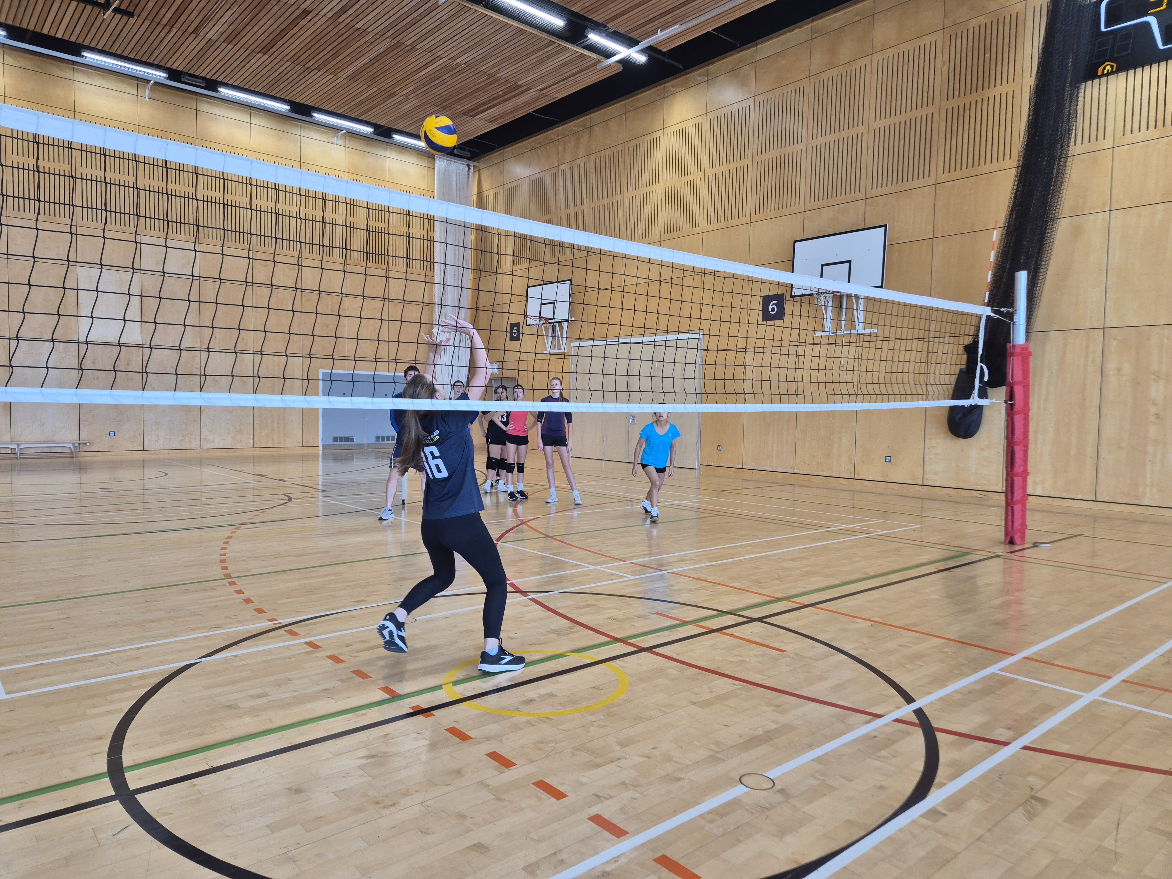 juniors playing volleyball indoor
