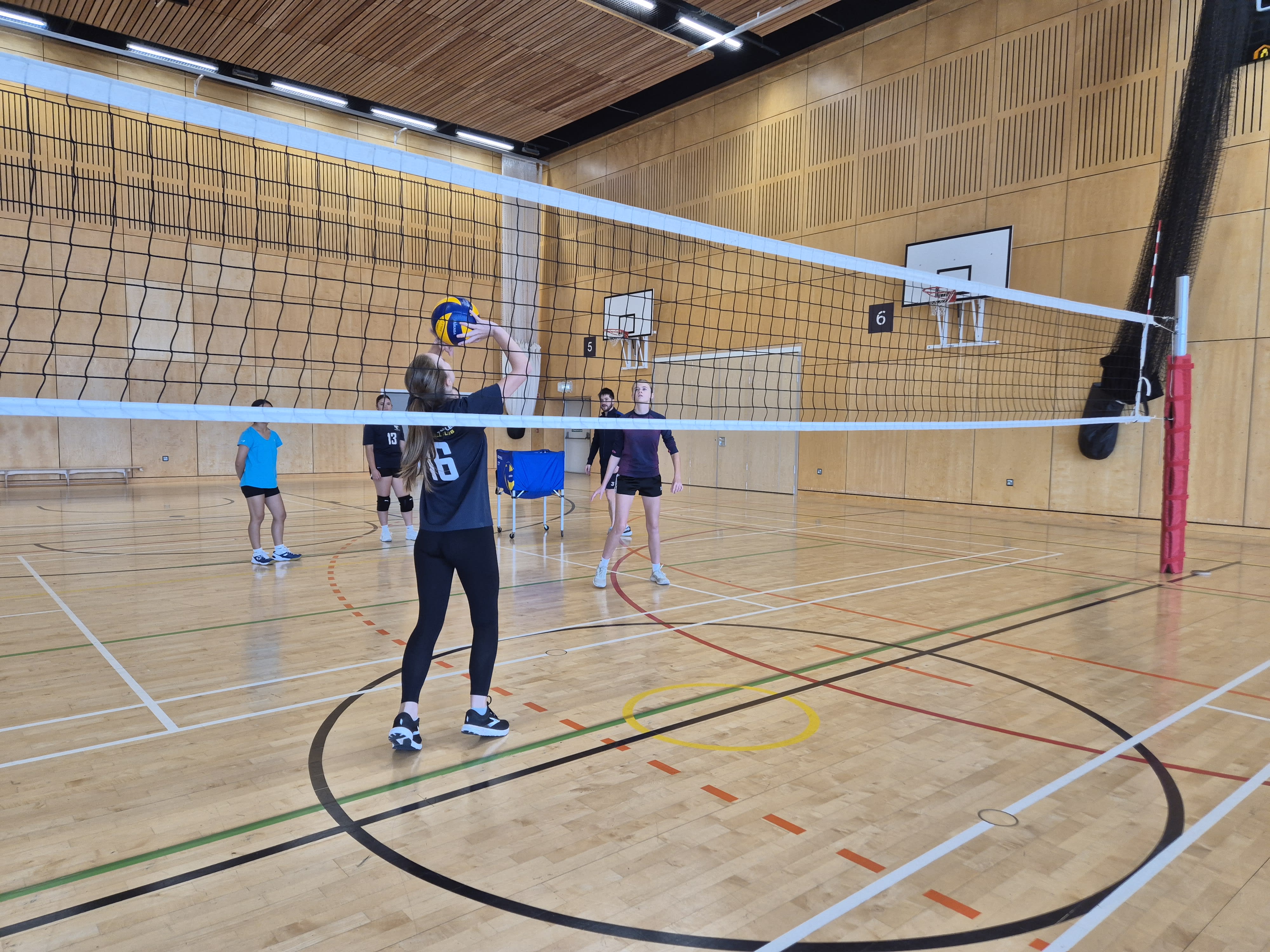 juniors playing volleyball indoor